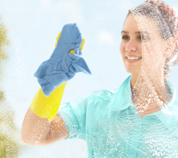 a woman cleaning a window
