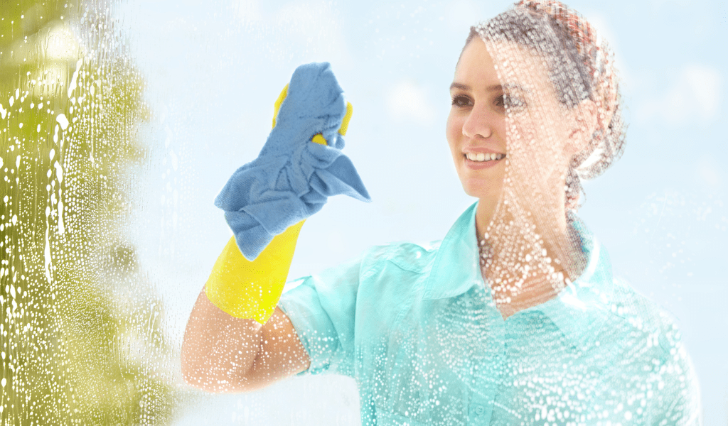 a woman cleaning a window