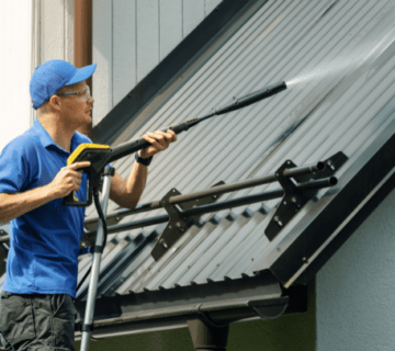 a man cleaning a rooft