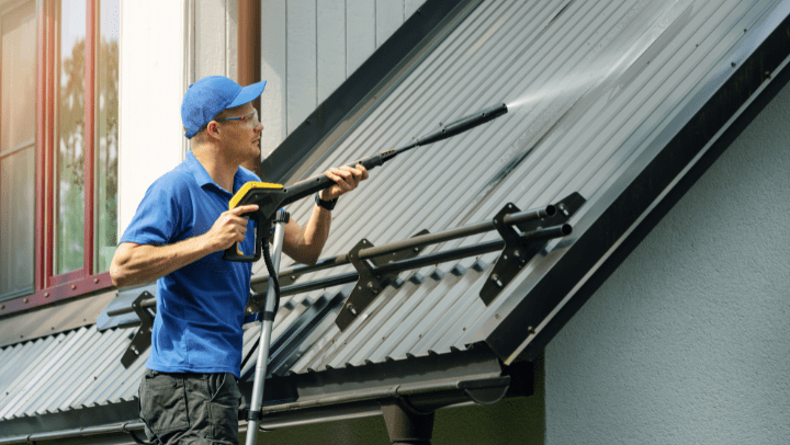 a man cleaning a rooft