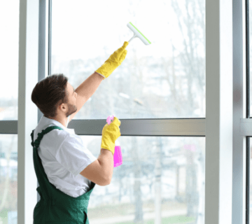 a man cleaning a window