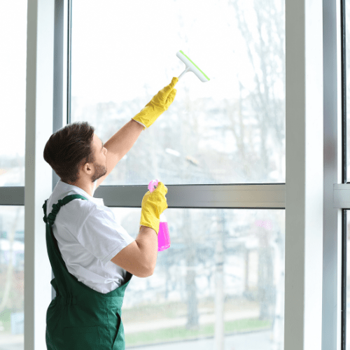 a man cleaning a window